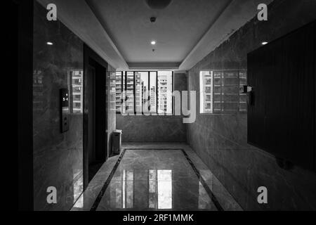 The sunny day interior of the apartment building hallway. Stock Photo