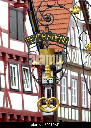 Bad Wimpfen, Baden-Wuerttemberg, Germany. Half-timbered house, town centre, old town, Feyerabend inn sign Stock Photo