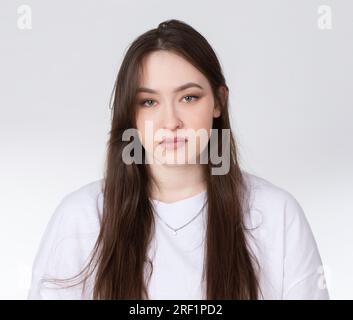 Portrait of a young beautiful Slavic girl with green eyes and long hair. Stock Photo