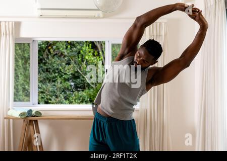 African american man practicing yoga at home Stock Photo