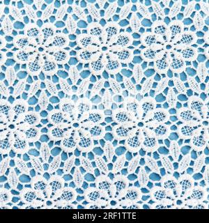 Fabric beauty double white-blue material with symmetrical pattern for tailoring tablecloths and other products Stock Photo