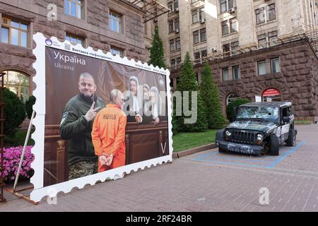 In the streets of Kyiv, a giant stamp depicts Putin's trial before the International Criminal Court Stock Photo