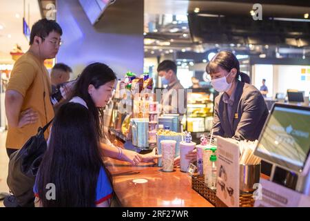 Beijing, China. 30th July, 2023. Audiences buy popcorn and drinks at a cinema in Yubei District of Chongqing, southwest China, July 30, 2023. Credit: Chu Jiayin/Xinhua/Alamy Live News Stock Photo