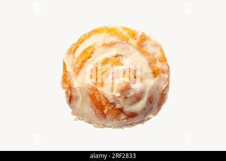 Brioche cinnamon swirl roll with cream icing on top isolated on a white background clip masked. Stock Photo
