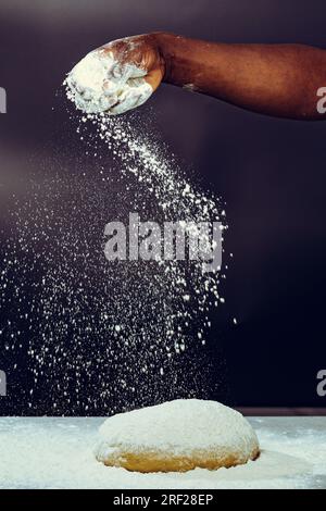 Soko Maize Meal Home Baking FlourCapwell Industries Limited Hand spreading wheat flour on the dough Stock Photo