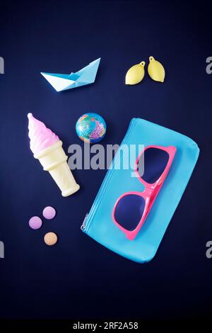 Top view on travel items against black Stock Photo