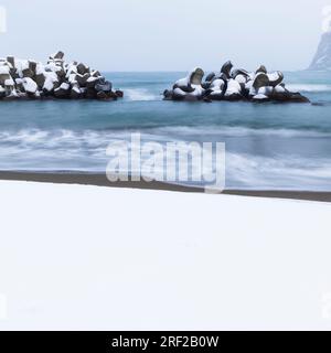 Long exposure shot of tetrapods in the winter sea, Yoichi, Hokkaido, Japan Stock Photo