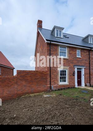 Brand new modern three storey brick built home constructed in traditional style on housing development in Suffolk, England. Stock Photo