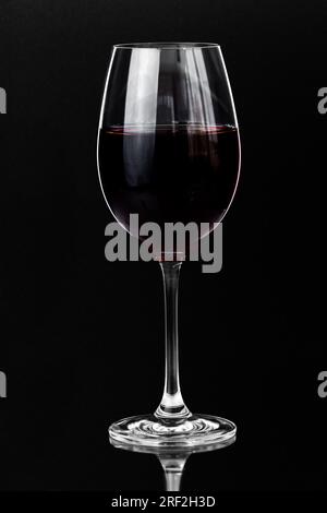 Red wine in a glass on a dark background with copy space Stock Photo