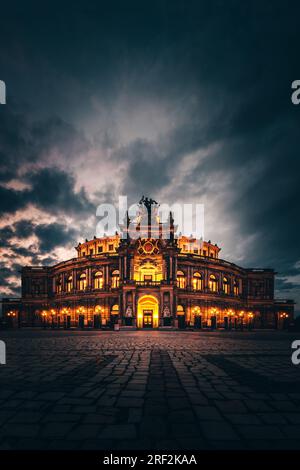 The Semper opera in Dresden is a famous historical building for music. Concert building in the evening in sunset. A highlight in Germany and a place t Stock Photo