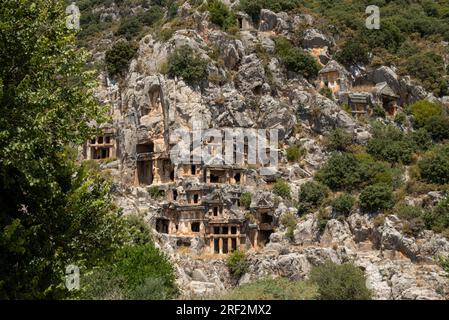 The ruins of the amphitheater and ancient rock tombs in the ancient city of Myra in Demre, Turkey Stock Photo