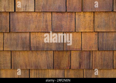 Rough bumpy wood shingle cladding, row of wooden material of small ...