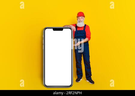 Photo of artisan architect demonstrate smart phone board booking construction restoration isolated vivid color background Stock Photo