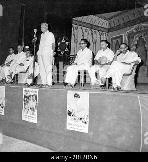 old vintage black and white 1900s picture of Indian meeting promoting savings antique Chicago radio microphone India 1940s Stock Photo