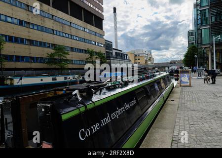 London - 05 28 2022: Docking of boats in Merchant Square in Paddington Basin navigating the Grand Union Canal Stock Photo