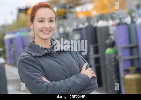 woman engineer standing and smiling at construction workplace Stock Photo