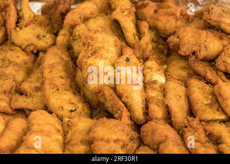 Variety of foods, potatoes, Ugali and dry fish, Chapati and beef stew, sausage and mandazi, samosa, Roasted potatoes chicken, rice vegetables kachumba Stock Photo