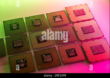 Collection of green and red illuminated computer processors (CPU) on a bright surface Stock Photo