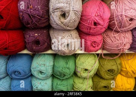 Colourful balls of wool displayed in a shop for sale Stock Photo