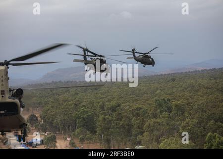 Townsland, Australia. 26 July, 2023. U.S. Army UH-60 Black Hawk helicopters, assigned to 16th Combat Aviation Brigade, Task Force Warhawk, Battle Group Griffin, take off for an air assault mission during multilateral exercise Talisman Sabre, July 26, 2023 in Townsville, Queensland, Australia.  Credit: Sgt. Ashunteia Smith/U.S. Army/Alamy Live News Stock Photo