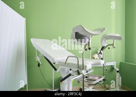 Gynecological examination chair in medical room Stock Photo