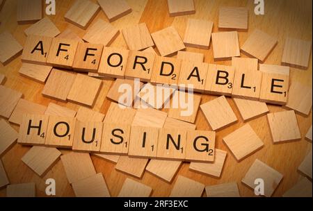 Affordable Housing, spelt out in Scrabble letters - UK SocialHousing and new build 80% of market cost provision Stock Photo