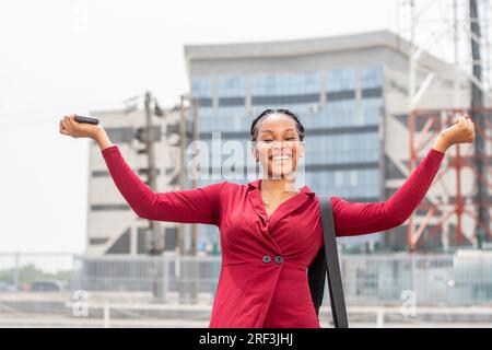 beautiful young african lady feeling happy and celebrates Stock Photo
