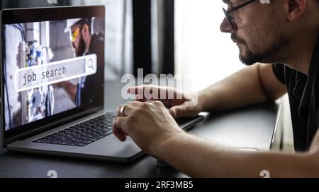 Man working on laptop and Information for the searching job, employment concept. Stock Photo