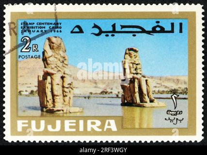 FUJEIRA - CIRCA 1966: a stamp printed in Fujeira shows colossi of Memnon, are two massive stone statues of Pharaoh Amenhotep III, Egypt, circa 1966 Stock Photo