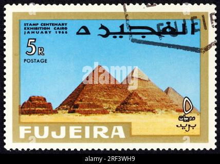 FUJEIRA - CIRCA 1966: a stamp printed in Fujeira shows pyramids of Giza, Egypt, circa 1966 Stock Photo