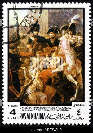 RAS AL-KHAIMAH - CIRCA 1970: a stamp printed in Ras al-Khaimah shows Entry of General Bonaparte into Alexandria, painting by Guillaume Colson, a Frenc Stock Photo