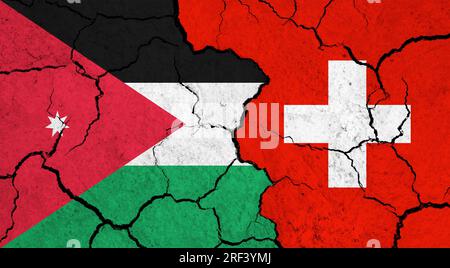 Flags of Jordan and Switzerland on cracked surface - politics, relationship concept Stock Photo