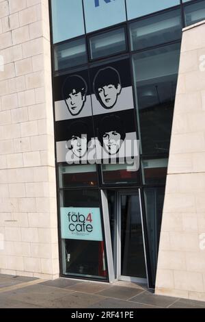 Entrance to the Fab 4 Cafe, related to the Beatles Museum, in the Modernist Pier Head Ferry Terminal Building (2009) on the Waterfront Liverpool UK Stock Photo