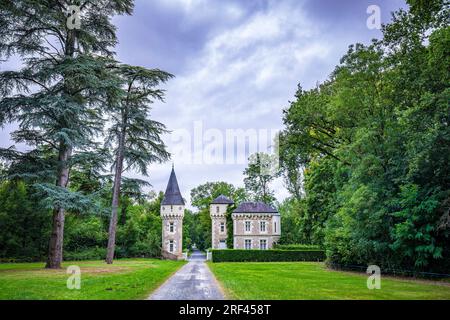 A small, hidden, pitoresk castle during a beautiful sunset on a dreamlike landscape on farmland. Stock Photo