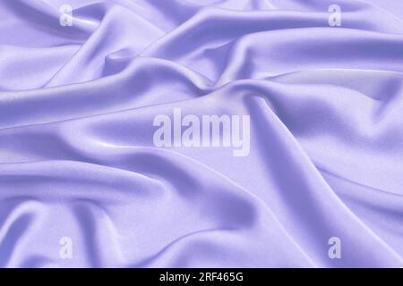 Blue silk or satin luxury fabric texture. Top view. Stock Photo