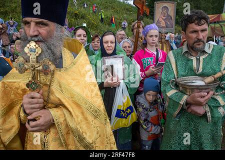 Tutaev town, Yaroslavl region, Russia. 30th, July 2023. Orthodox priest and believers take part in a religious procession with the All-Merciful Savior icon in the town of Tutayev. The procession is held annually on the dedication day of the Resurrection Cathedral, the tenth Sunday after Orthodox Easter, to mark the recovery of the All-Merciful Savior icon in 1793 from the town of Rostov Veliky where the icon had remained for 44 years Stock Photo