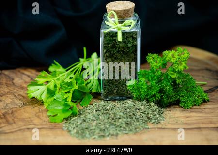 Fresh green parsley or dried and rubbed parsley Petroselinum crispum Stock Photo