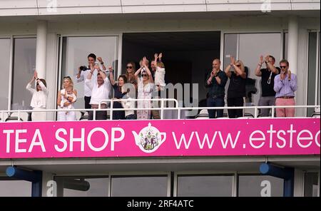 The friends and family of England's Stuart Broad celebrate on a balcony after he takes the wicket of Australia's Todd Murphy during day five of the fifth LV= Insurance Ashes Series test match at The Kia Oval, London. Picture date: Monday July 31, 2023. Stock Photo