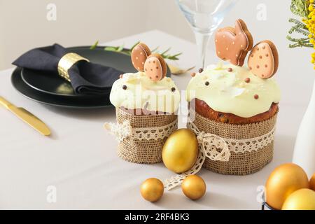 Easter cakes with eggs on light tablecloth, closeup Stock Photo