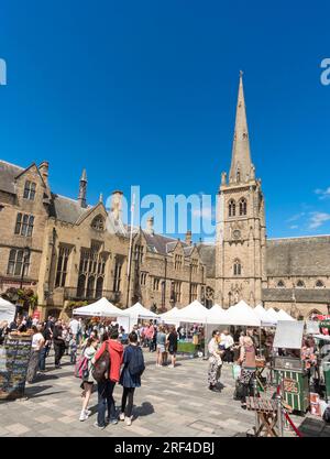 People visiting Durham outdoor market in Durham city Market Place Stock Photo