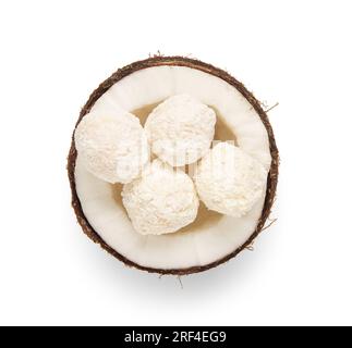 Coconut with delicious chocolate candies isolated on white background Stock Photo