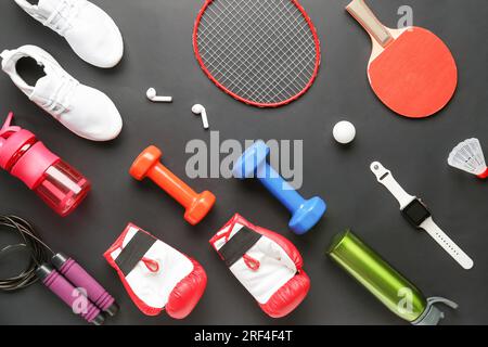 Set of sports equipment with gadgets on dark background Stock Photo