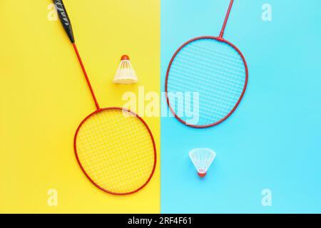 Badminton shuttlecocks and rackets on color background Stock Photo