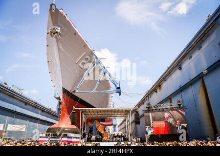 Bath, United States. 29 July, 2023. U.S. retired Marine Col. Harvey C. Barnum Jr., delivers remarks during the christening ceremony for the Arleigh-burke class guided-missile destroyers USS Harvey C. Barnum at Bath Iron Works, July 29, 2023 in Bath, Maine. Barnum, a veteran of Vietnam and recipient of the Medal of Honor served as in senior positions in the Pentagon until 2009.  Credit: MCC Shannon Renfroe/U.S Navy Photo/Alamy Live News Stock Photo