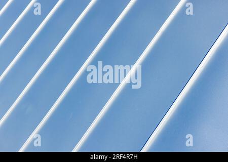 New roof made of shiny stainless steel plates, abstract architecture background photo, metal texture Stock Photo