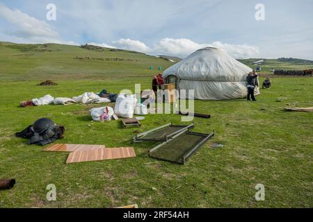 A Kazakh herder family is erecting a ger in a remote valley in the Altai Mountains (Altay Mountains) near Altai Sum about 200 kilometers from Ulgii (Ö Stock Photo