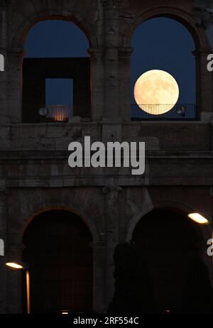 Rome. 31st July, 2023. Photo taken on July 31, 2023 shows the moon rising over Rome, Italy. Credit: Alberto Lingria/Xinhua/Alamy Live News Stock Photo