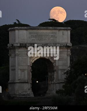 Rome. 31st July, 2023. Photo taken on July 31, 2023 shows the moon rising over Rome, Italy. Credit: Alberto Lingria/Xinhua/Alamy Live News Stock Photo