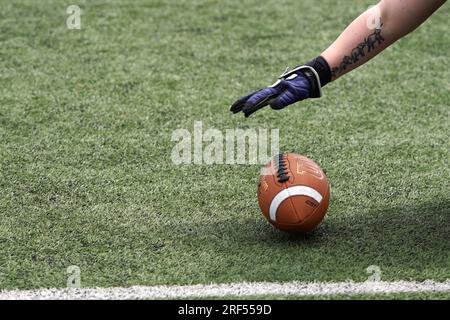 Chasing a bouncing American Football Stock Photo