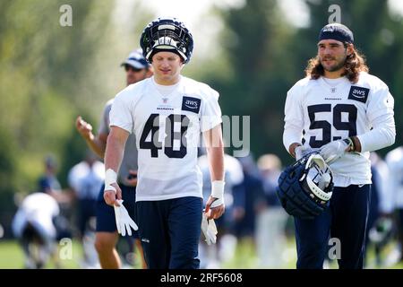 Seattle Seahawks linebacker Jon Rhattigan walks off the field with his  helmet off after playing the